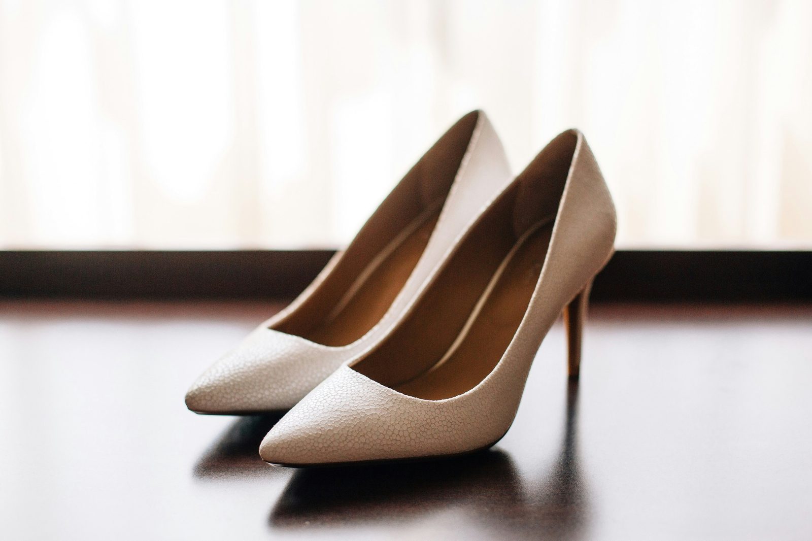A pair of nude court shoes